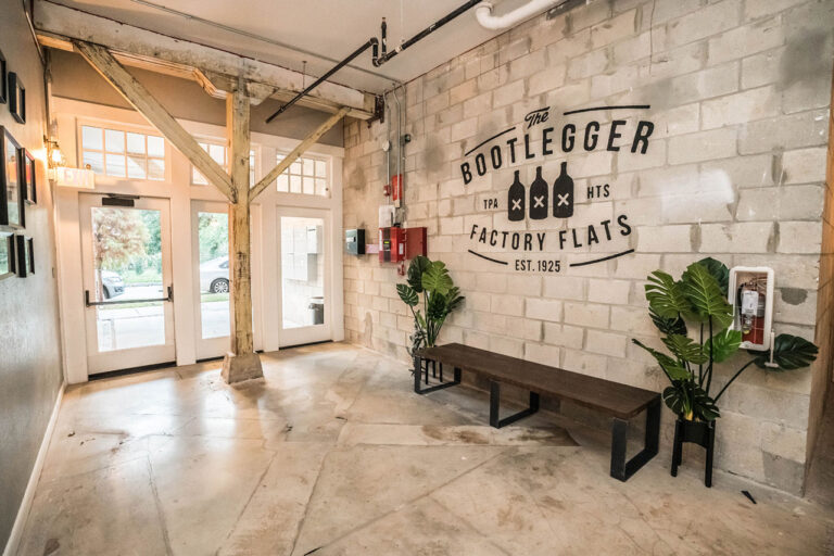 Bootlegger Flats lobby with property logo on wall